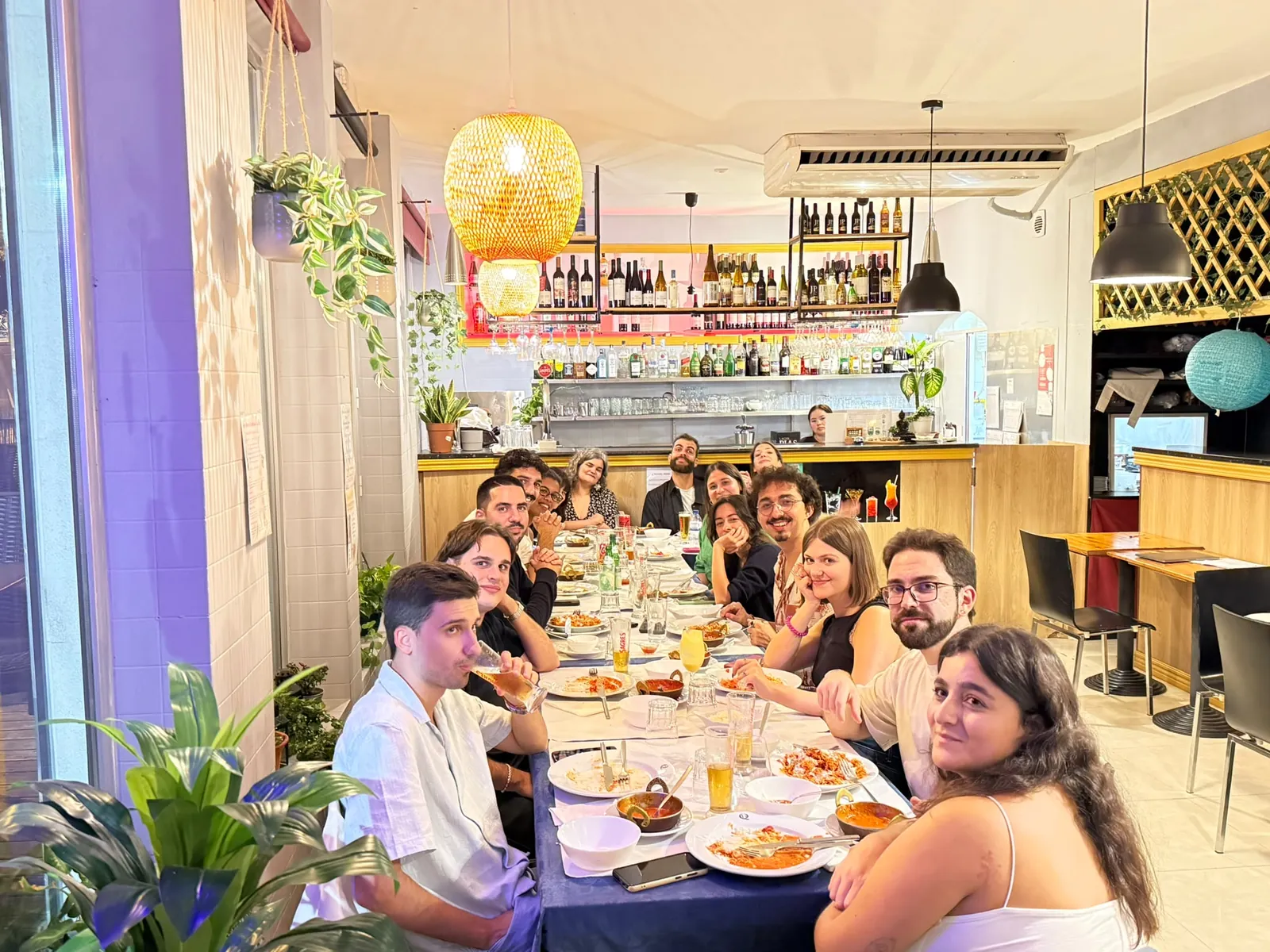 A large group gathered around the table at Aradhana