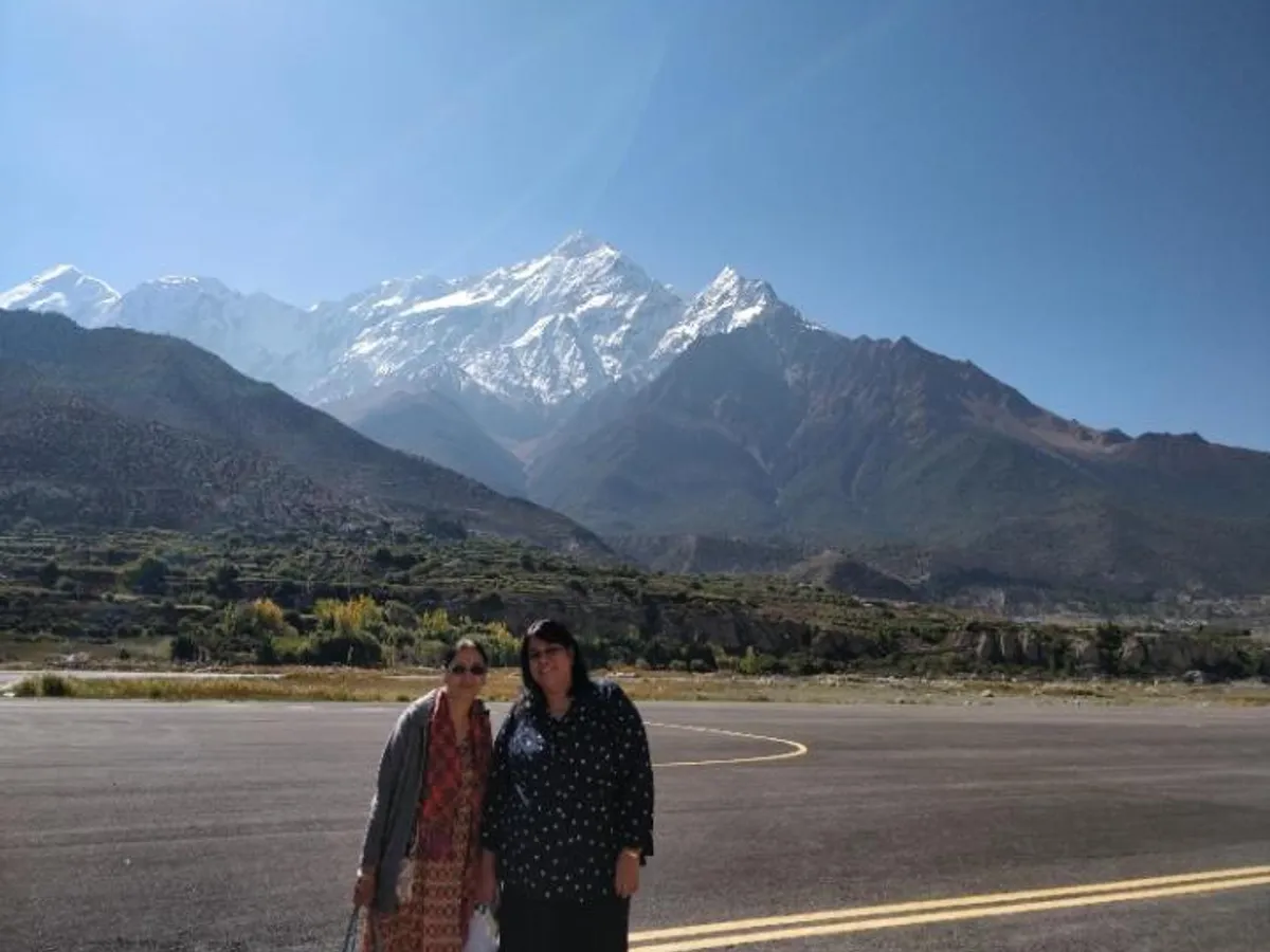 Guests arriving at Jomsom airstrip with the Himalaya behind them